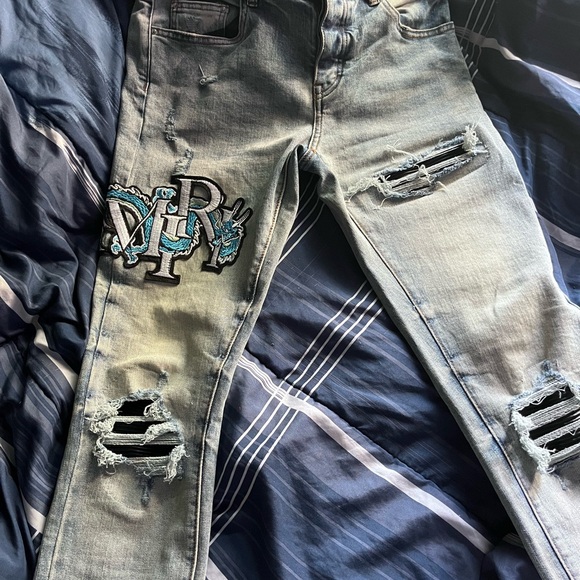 Distressed Light Blue Jeans with Patch